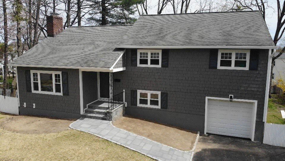 Front of home with dark gray James Hardie siding in White Plains