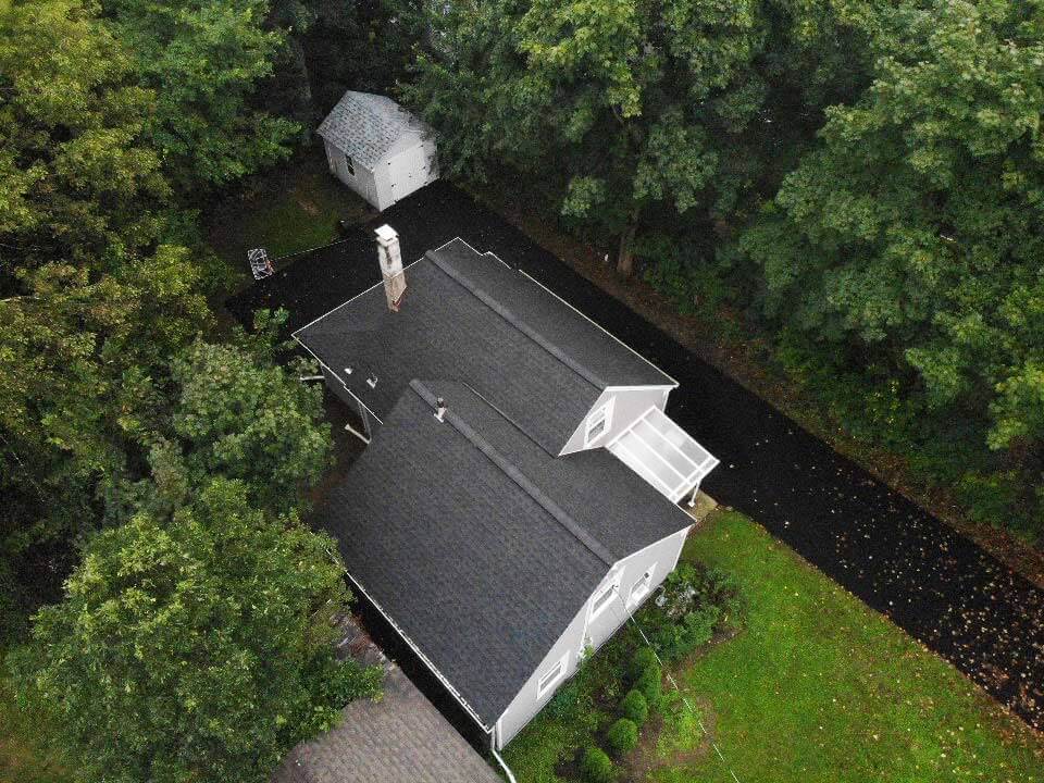 Overhead view of dark gray GAF asphalt shingles on home