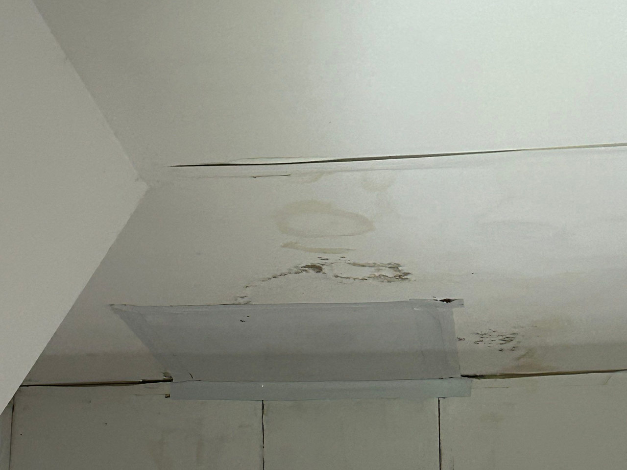 Discoloration on ceiling caused by roof leak