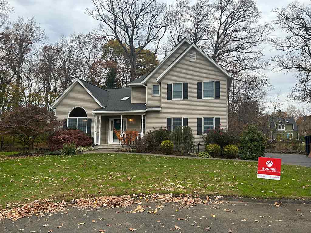 front view testimonial house with Gunner sign